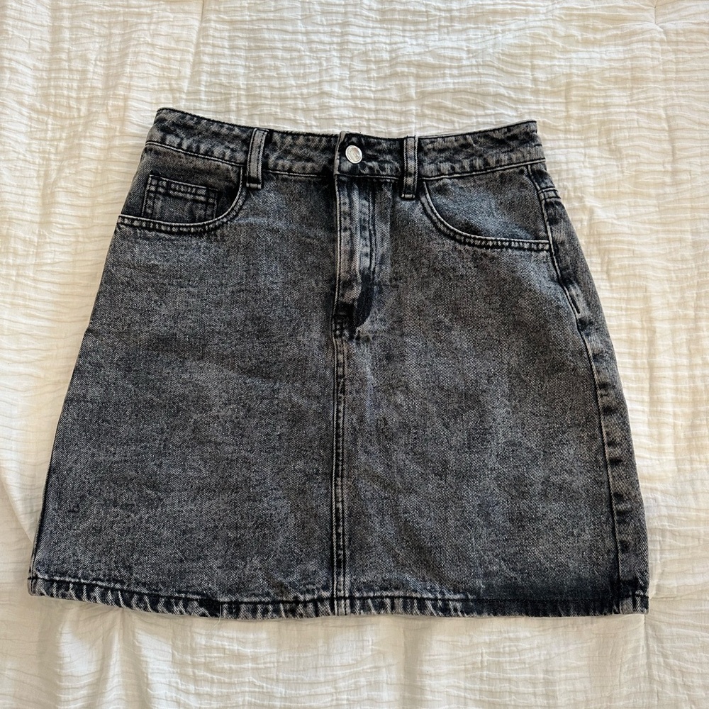 Distressed black denim skirt